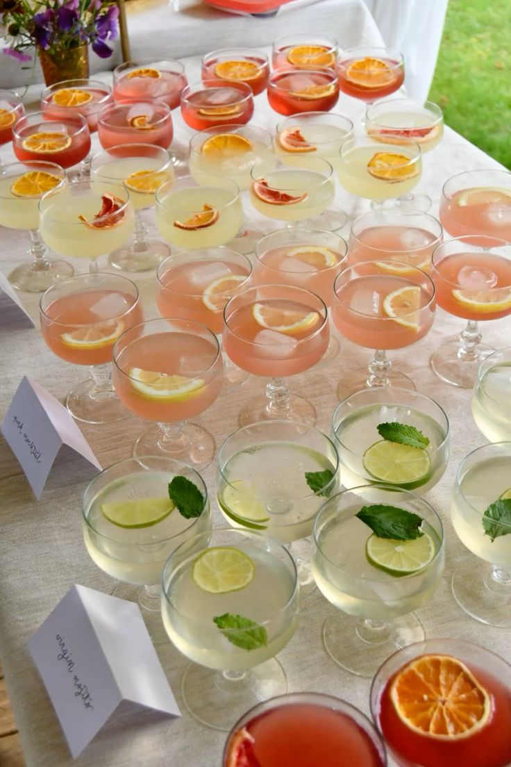 This image shows 3 different cocktails all laid out on a white table.
