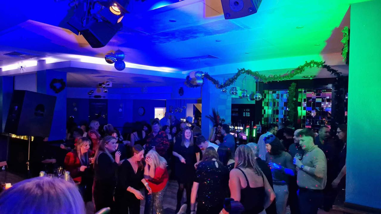 The image shows a Christmas party night at The Jazz Cafe, Reading.